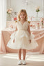 LAYERED TULLE SPECIAL OCCASION DRESS WITH SEQUIN BOW