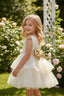 LAYERED TULLE SPECIAL OCCASION DRESS WITH SEQUIN BOW