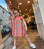 ORANGE BLUE PATTERNED DRESS WITH BOW DETAIL ON THE BACK