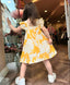 YELLOW DRESS WITH FLOWER EMBROIDERED BOW DETAIL ON THE COLLAR