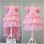 PINK LAYERED ELEGANT GOWN FOR BIRTHDAY SPECIAL OCCASIONS WITH TIARA AND TULLE GLOVE COMBINATION CAN BE WORN WITH A LONG OR SHORT BACK DESIGN