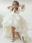 WHITE LAYERED ELEGANT GOWN FOR BIRTHDAY SPECIAL OCCASIONS WITH TIARA AND TULLE GLOVE COMBINATION CAN BE WORN WITH A LONG OR SHORT BACK DESIGN